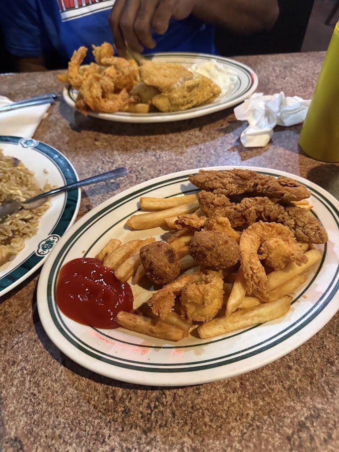 Entrées served with sides on white plates.