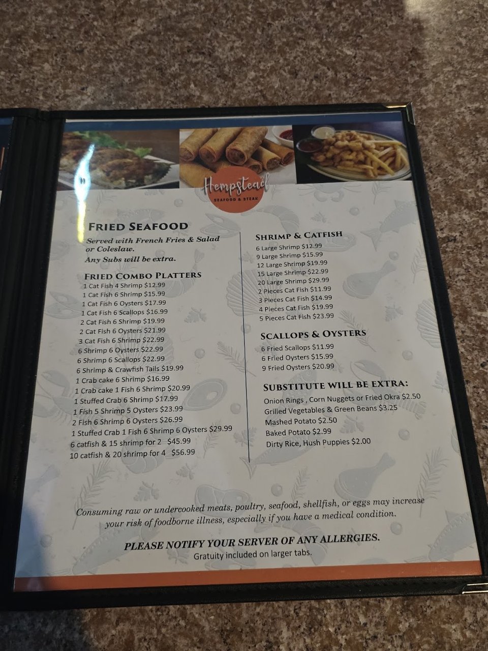 Printed dishes featuring seafood and ribeye options.